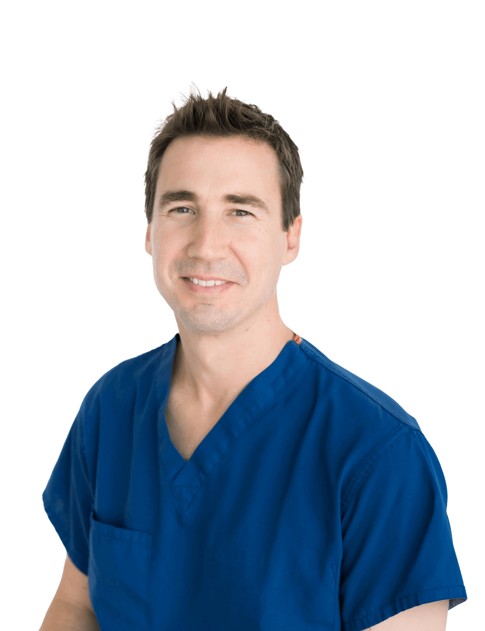 Dr. Garrett "Reed" Poole wearing blue medical scrubs in a dental office.